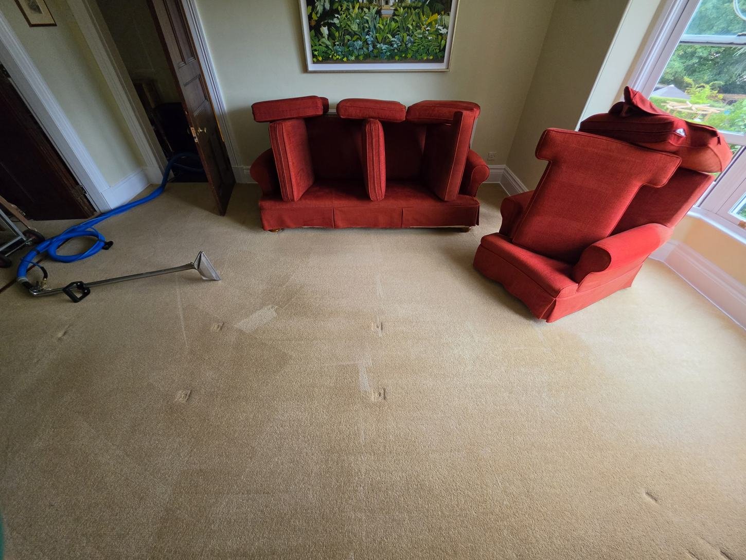 Upholstery Cleaning Doncaster | Sofa & Chair Cleaning 1 Real New Life Carpet customer room with upholstered red seating and cleaning equipment