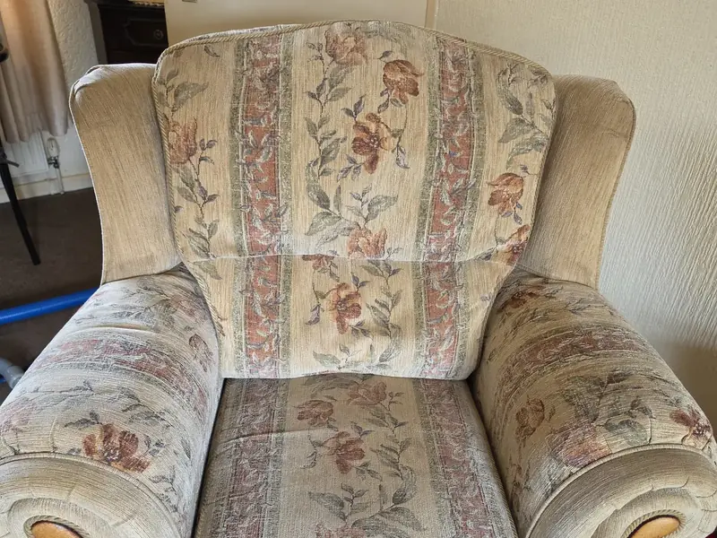 Carpet & Upholstery Cleaning Featherstone & Ackworth 2 Floral fabric armchair with a cleaning hose nearby