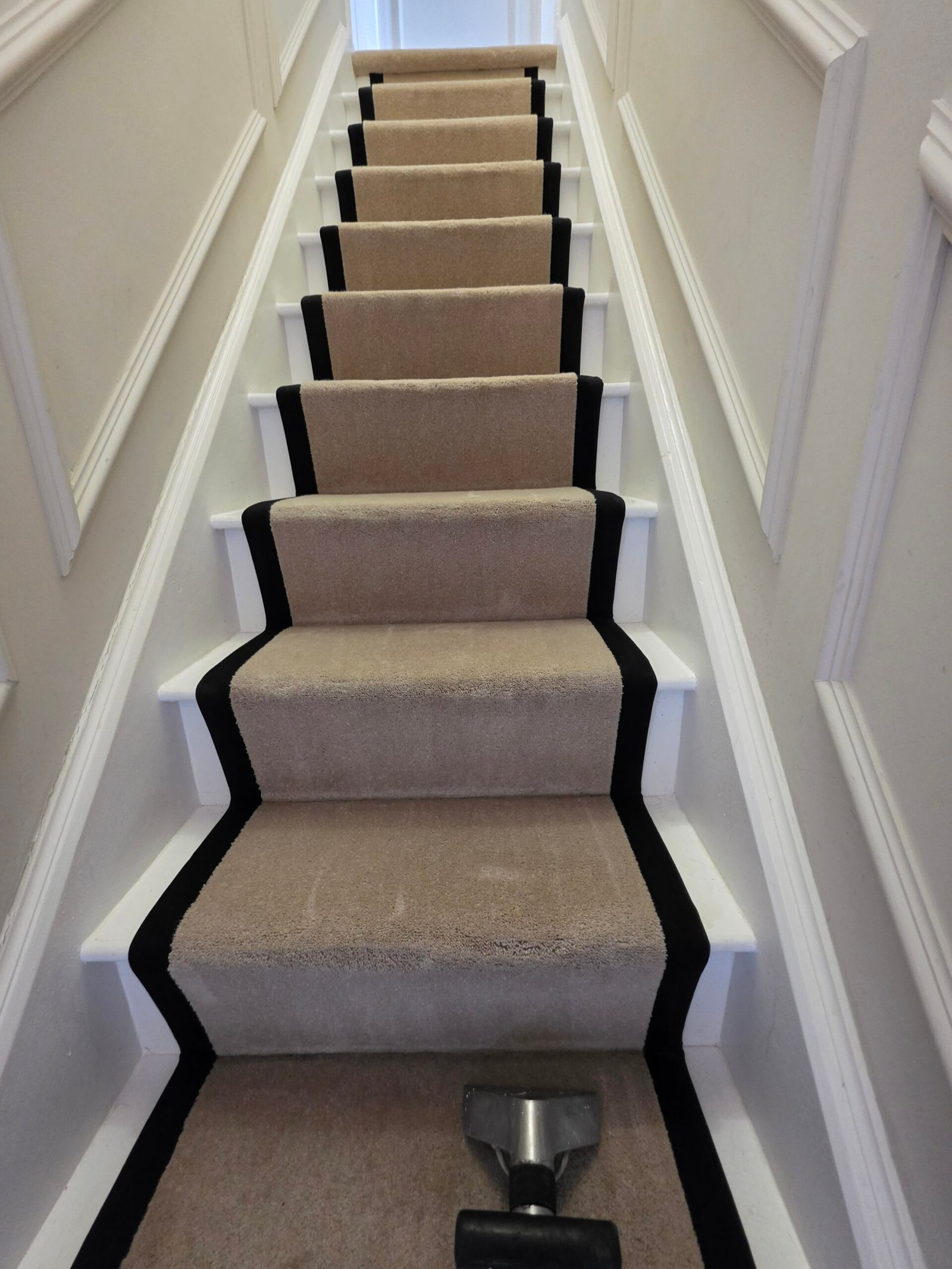 Can Professional Carpet Cleaning Remove Dog Urine Smell? 1 Professional carpet cleaning extraction wand on a fitted stair carpet, New Life Carpet