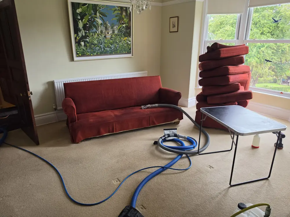 Carpet Cleaning in Pontefract 4 Red fabric sofa with cushions removed and cleaning equipment set up in a living room