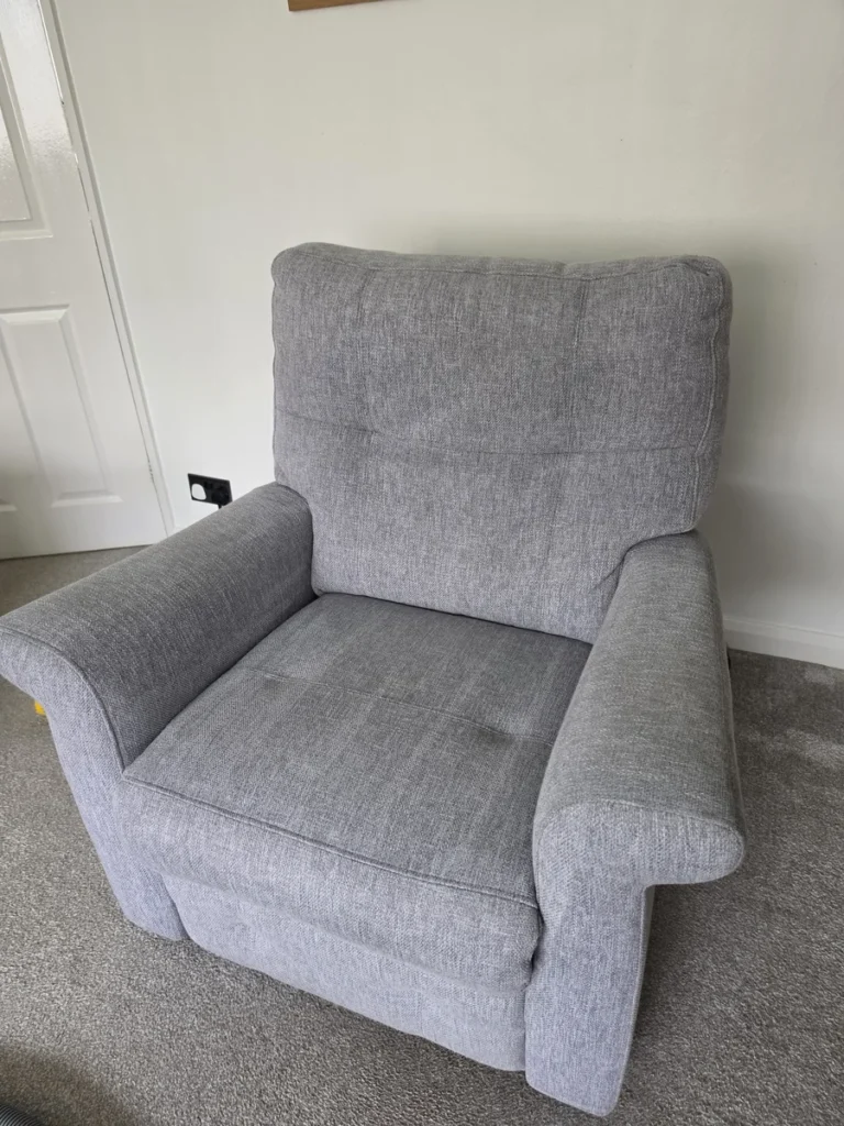 Grey fabric armchair after cleaning by New Life Carpet