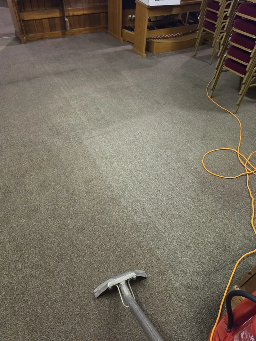 Carpet Cleaning at St Thomas Church of England 4 Carpet cleaning wand and visible cleaning passes beside the organ and stacked chairs at St Thomas Church of England