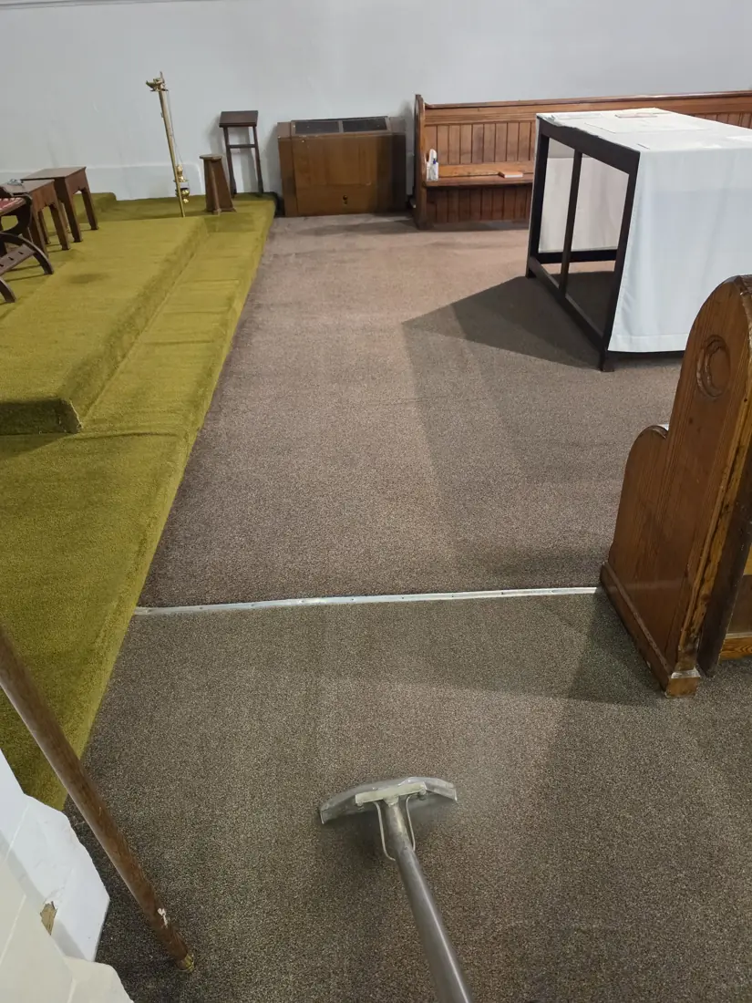 Carpet Cleaning at St Thomas Church of England 3 Carpet extraction wand on carpet beside the raised front area at St Thomas Church of England